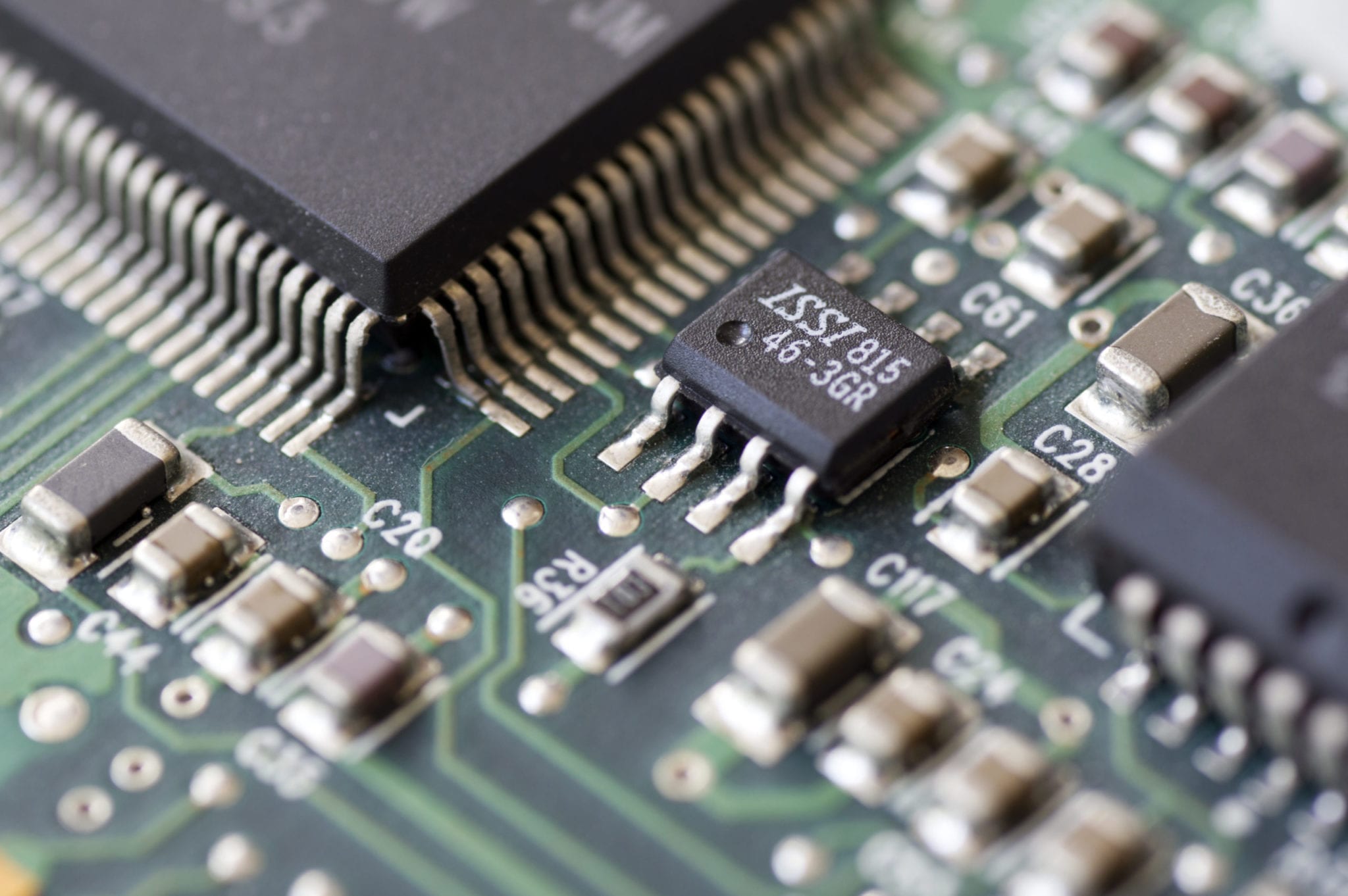 Closeup of a printed circuit board with components such as integrated circuits